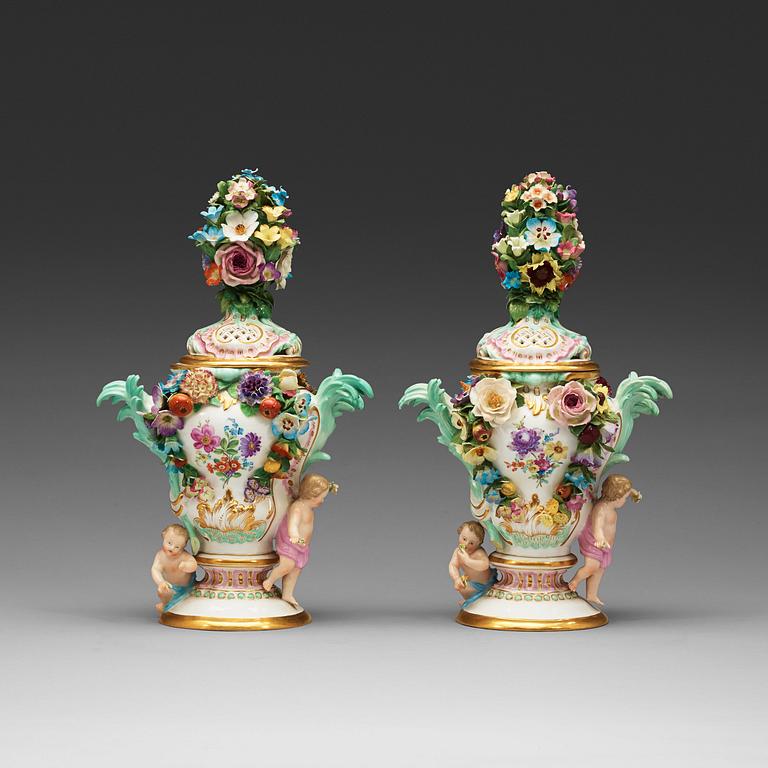 A pair of Meissen pot-purri jars with covers, 19th Century.