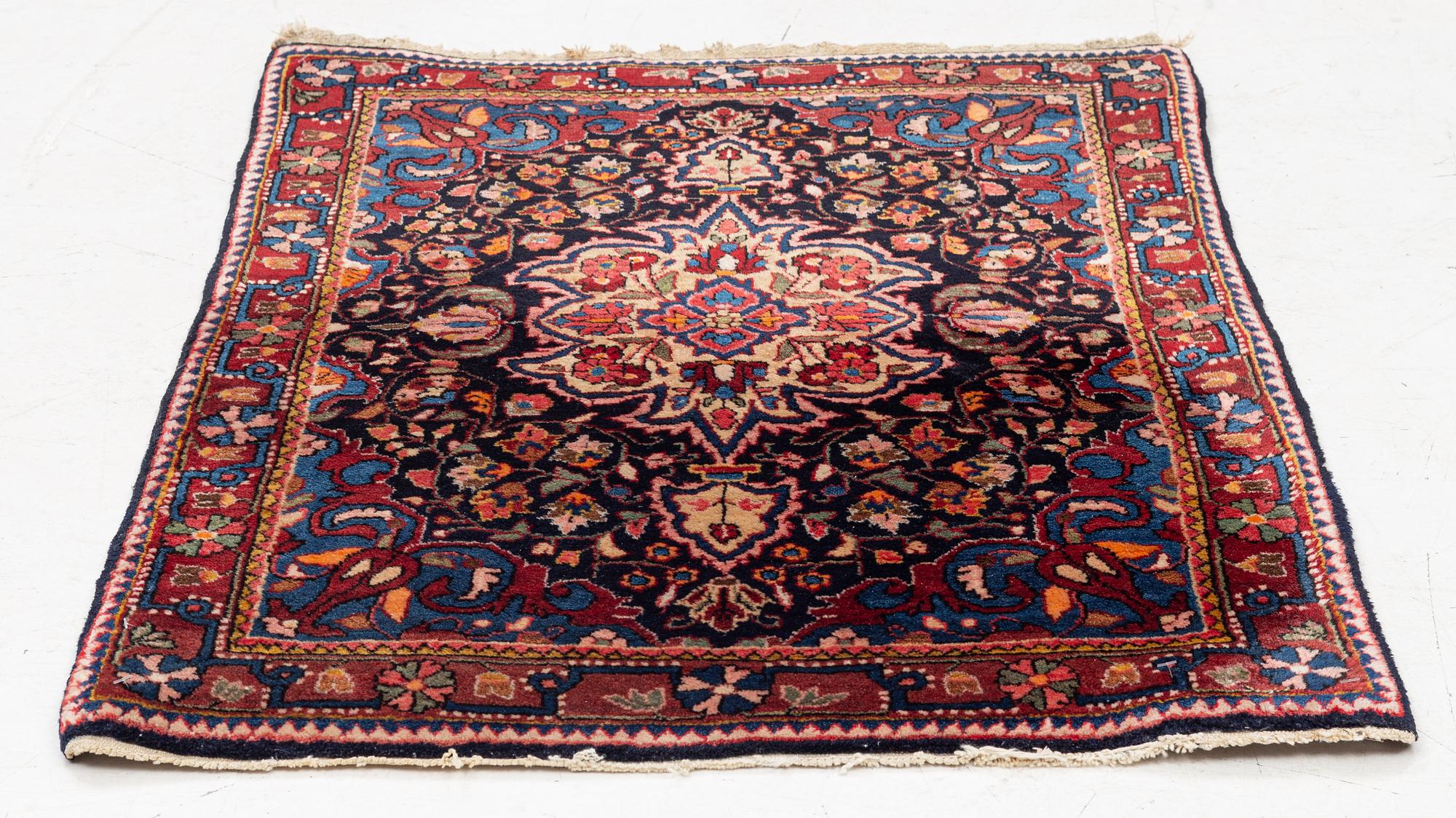 A Sarouk/Jozan rug, c. 86 x 64 cm.