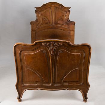 A pair of early 20th Century art nouveau style beds.