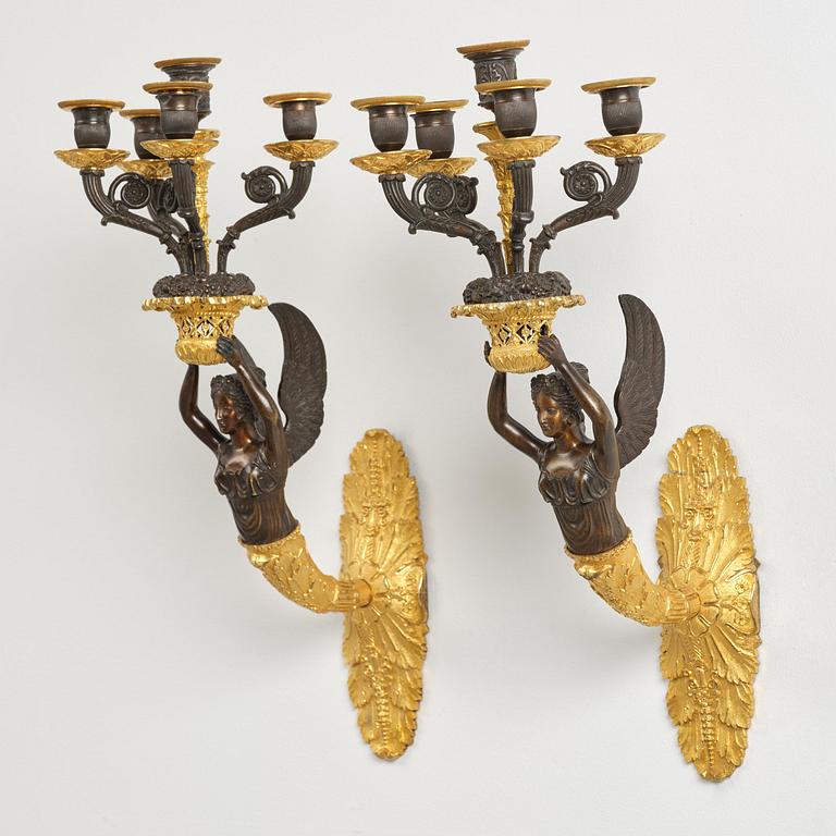 A pair of French Empire five-branch gilt and patinated bronze appliques, first part 19th century.