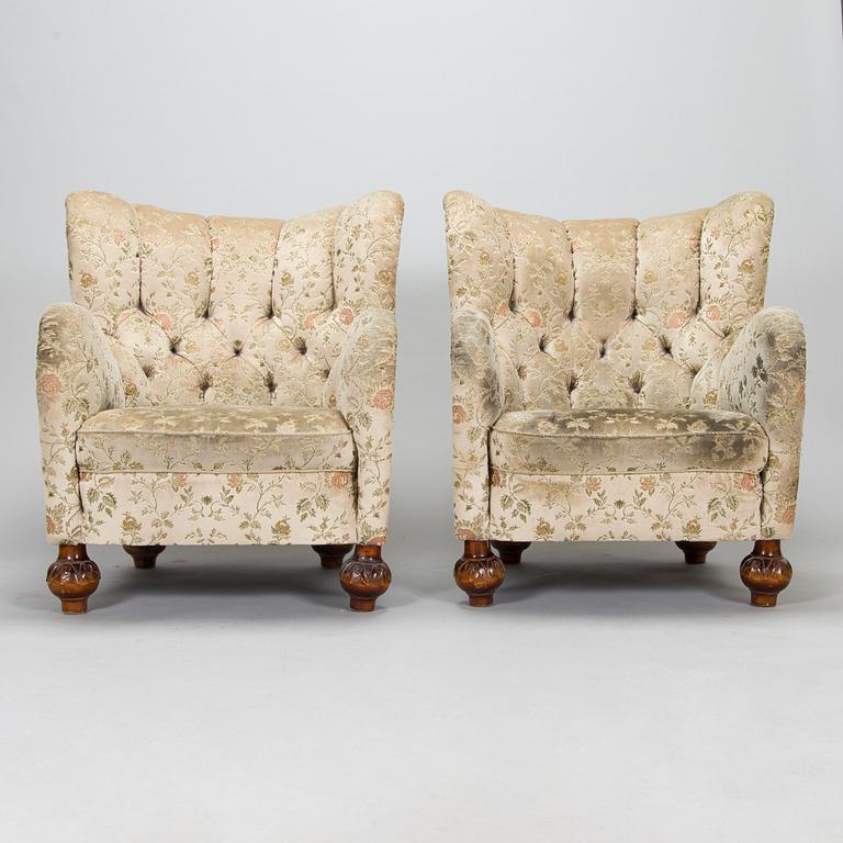 A pair of mid-20th-century armchairs.