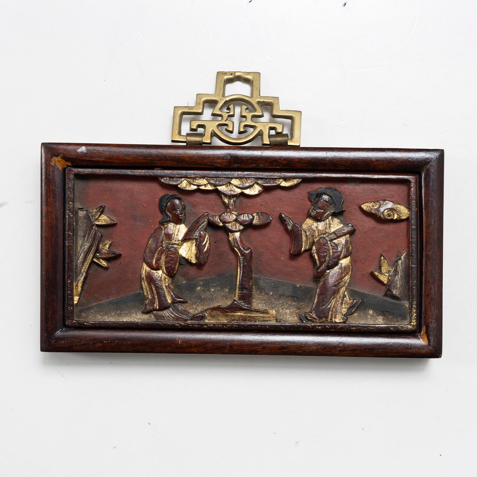 Three Chinese lacquer and wooden panels, two silk embroideries, first half of the 20th century.