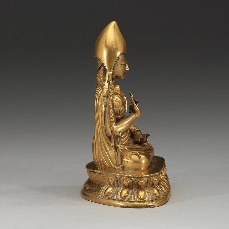 A gilt bronze figure of Seventh Dalai Lama, Lobzang Kalzang Gyatso, Qing dynasty (1644-1912).