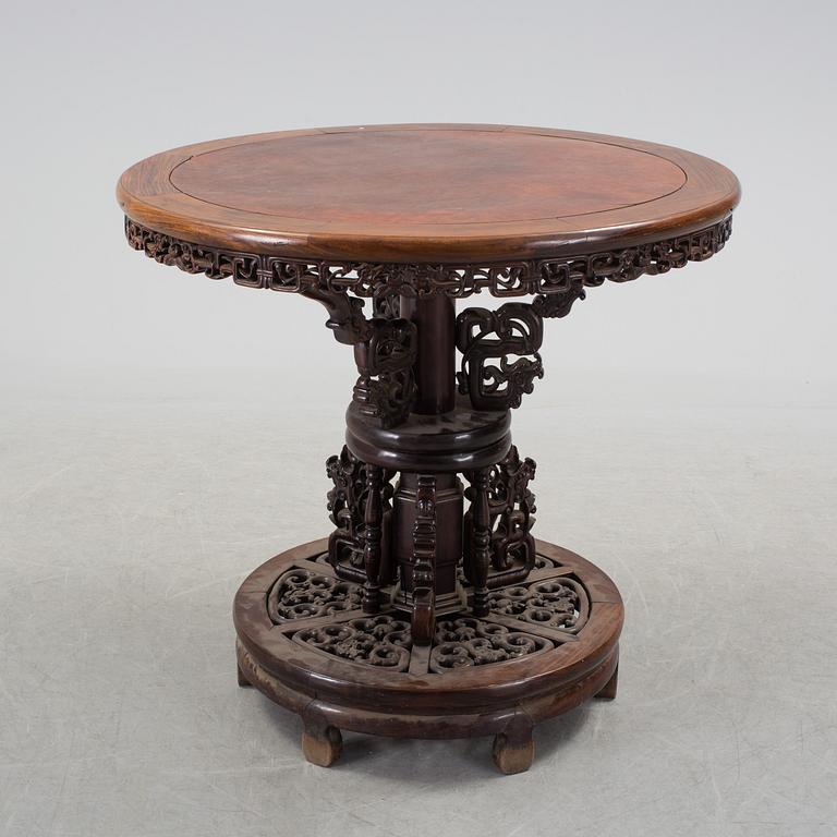 A Chinese wooden table, early 20th century.