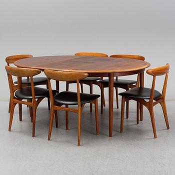 KURT ØSTERVIG, a teak dining suite with a round table and six chairs, Brande Möbelindustri, Denmark.