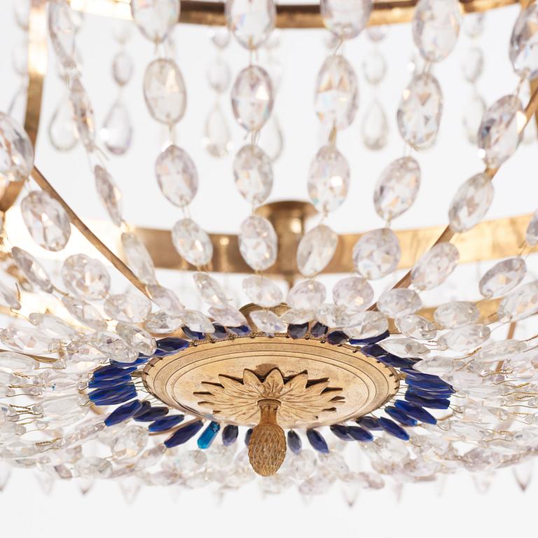 A late Gustavian gilt brass and cut glass thirteen-light chandelier, circa 1800.