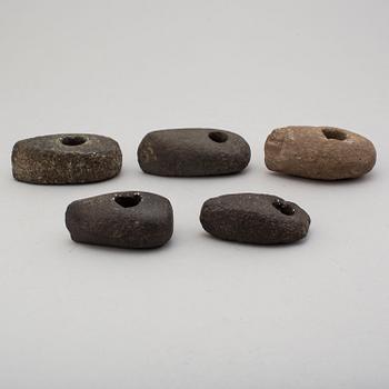 Five neolithic stone axes.