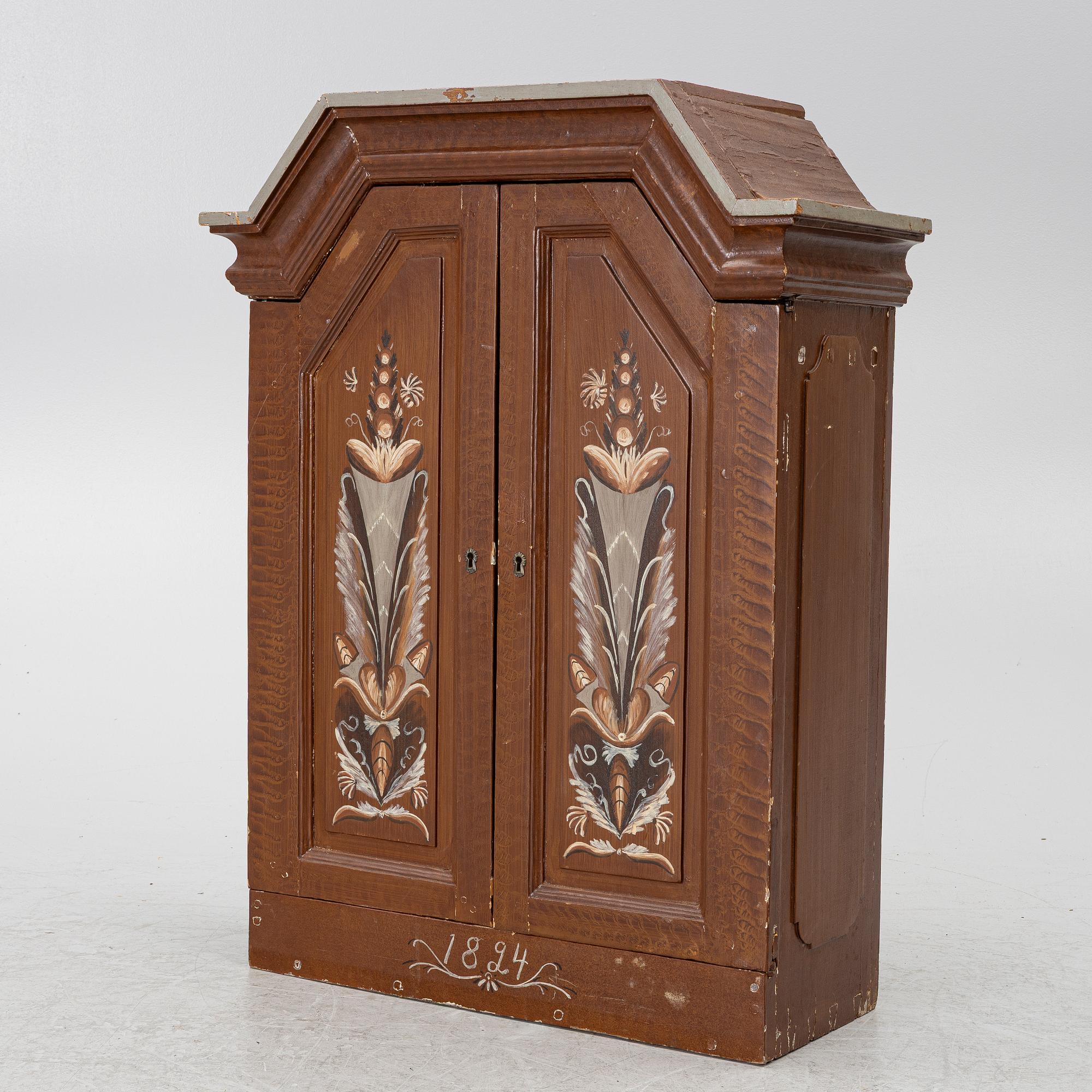 A cabinet, dated 1824.