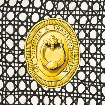 Hermès, a 'Les Voitures a Transformation' silk scarf.