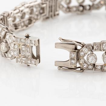 A platinum bracelet with round brilliant-and eight-cut diamonds.