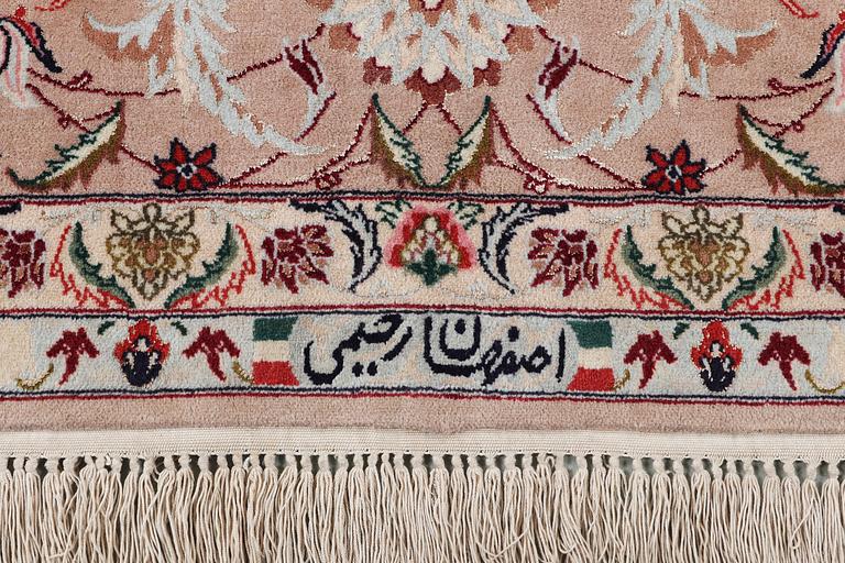 A signed Esfahan carpet, part silk, c. 298 x 206 cm.