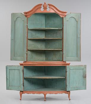 A rococo corner cabinet, later part 18th century.