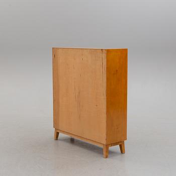 A 1940s birch cabinet.