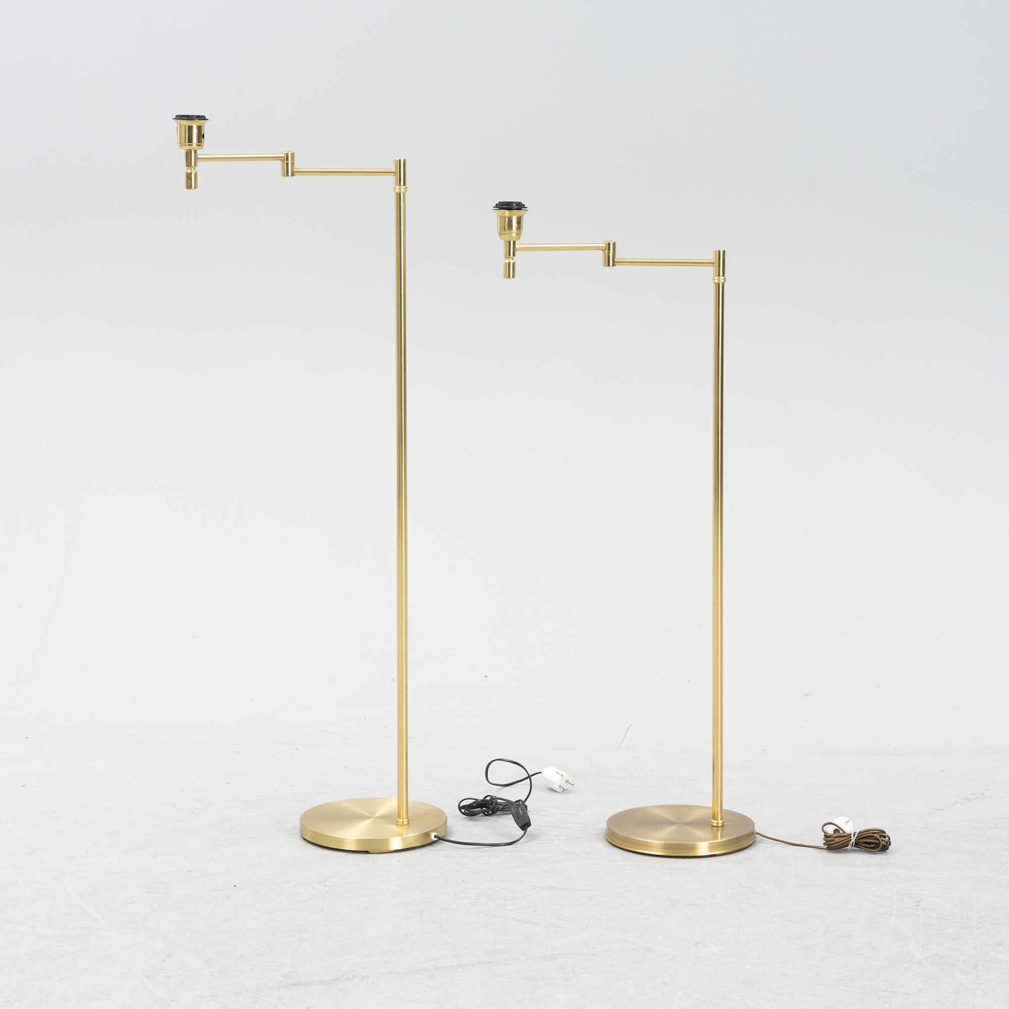 A pair of brass floor lamps, EWÅ, Sweden, second half of the 20th century.