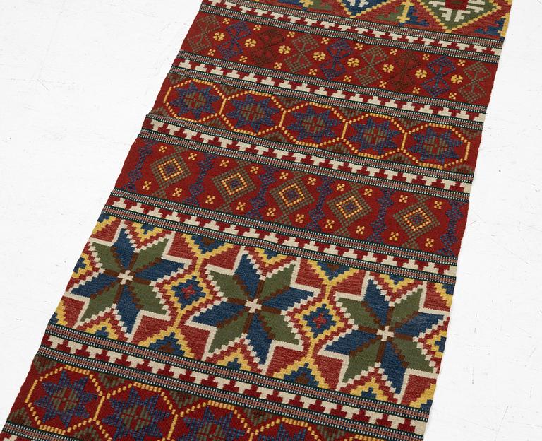 A bench cushion, flat weave, c. 262 x 64 cm, Scania, around the year 1900.