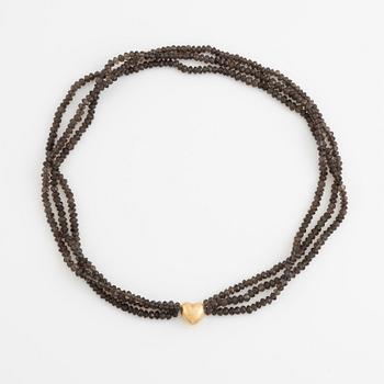 Ole Lynggaard,  smoky quartz necklace, clasp gold heart.