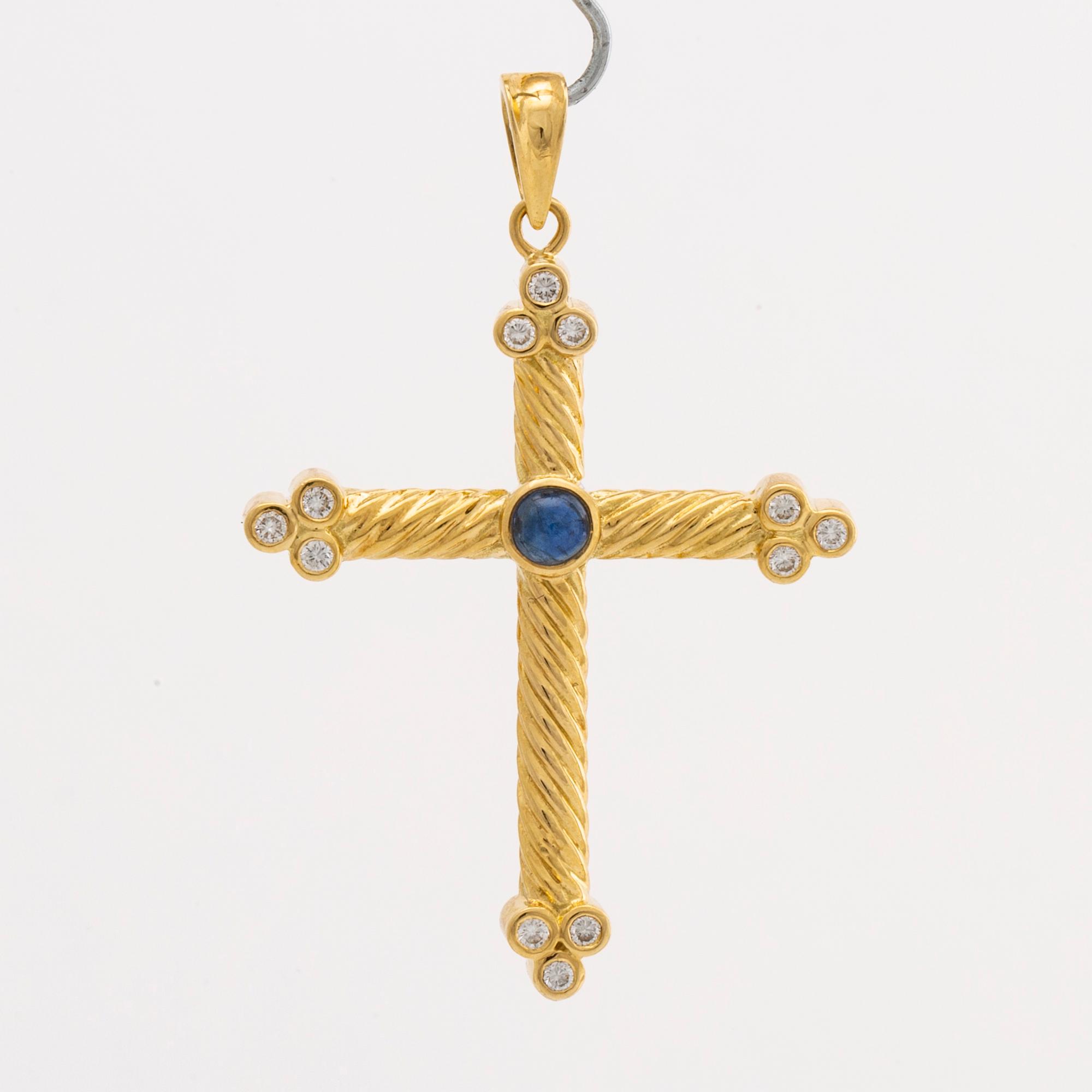 CROSS 18K gold brilliant-cut diamonds approx 0,25 ct and 1 cabochon-cut sapphire.