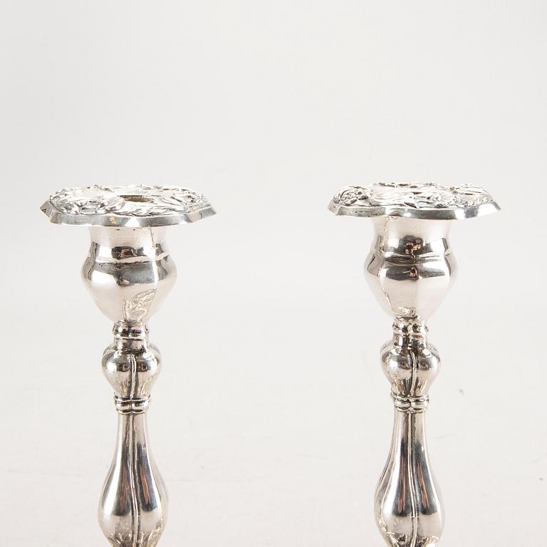 A 19th century pair of silver candle sticks mark of Oskar Närman Mariestad 1877.