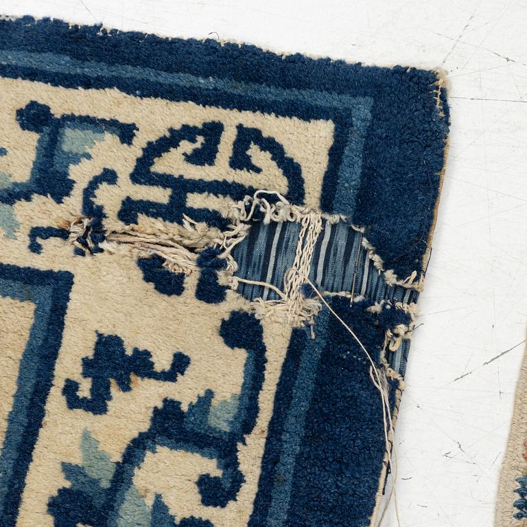 Two Chinese carpet fragments, late Qing dynasty.