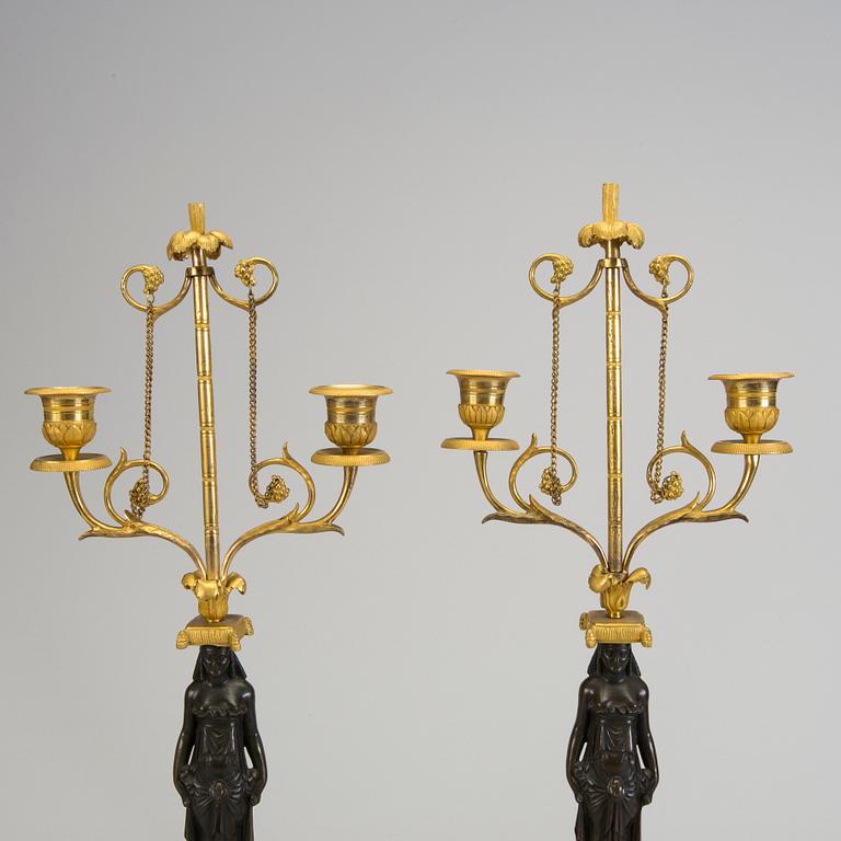 A pair of 1800s empire candelabras.