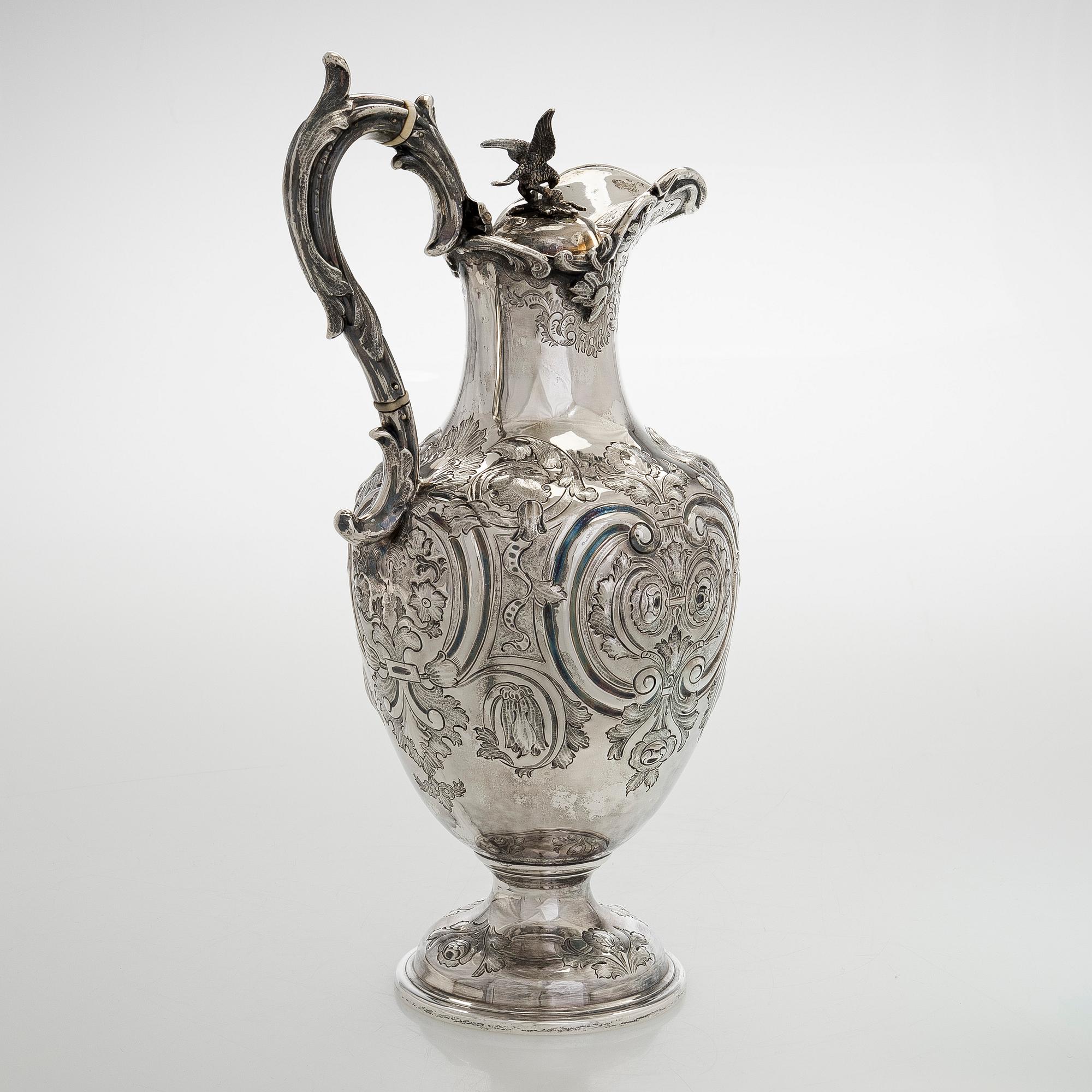 A sterling silver jug, maker's mark of Martin, Hall & Co, Sheffield 1877.