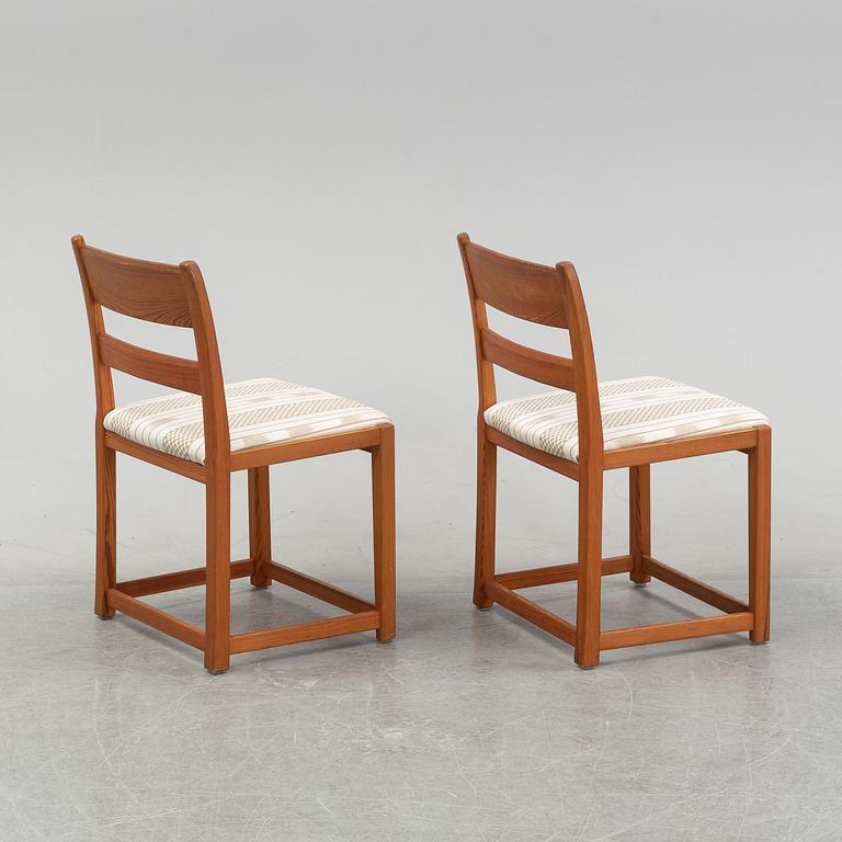 Six chairs by Carl Malmsten and a table by an unknown maker.