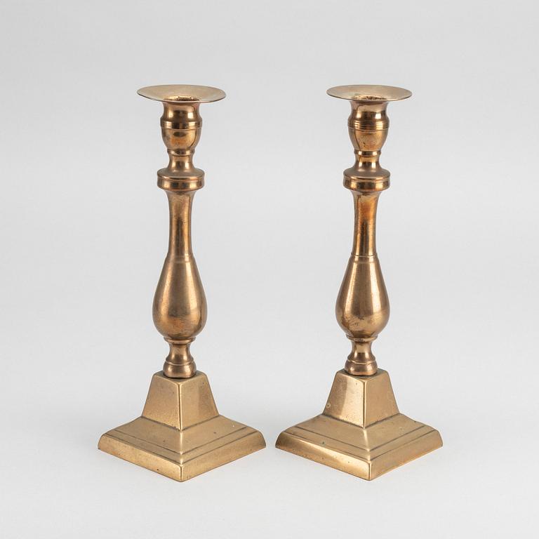 A PAIR OF EMPIRE CANDLESTICKS.