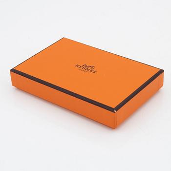 Hermès, a orange leather 'Dogon' wallet, 1998.