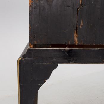 AN early 18TH CENTURY PROBABLY ENGLISH Japanned laquer cabinet on stand.