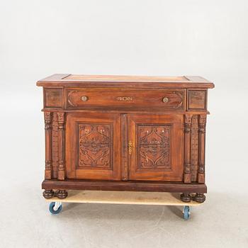 An early 1900s mahogany display cabinet.