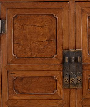 A huanghuali veneered, huamu and mixed wood cabinet, 19th century, Qing dynasty, 19th Century.