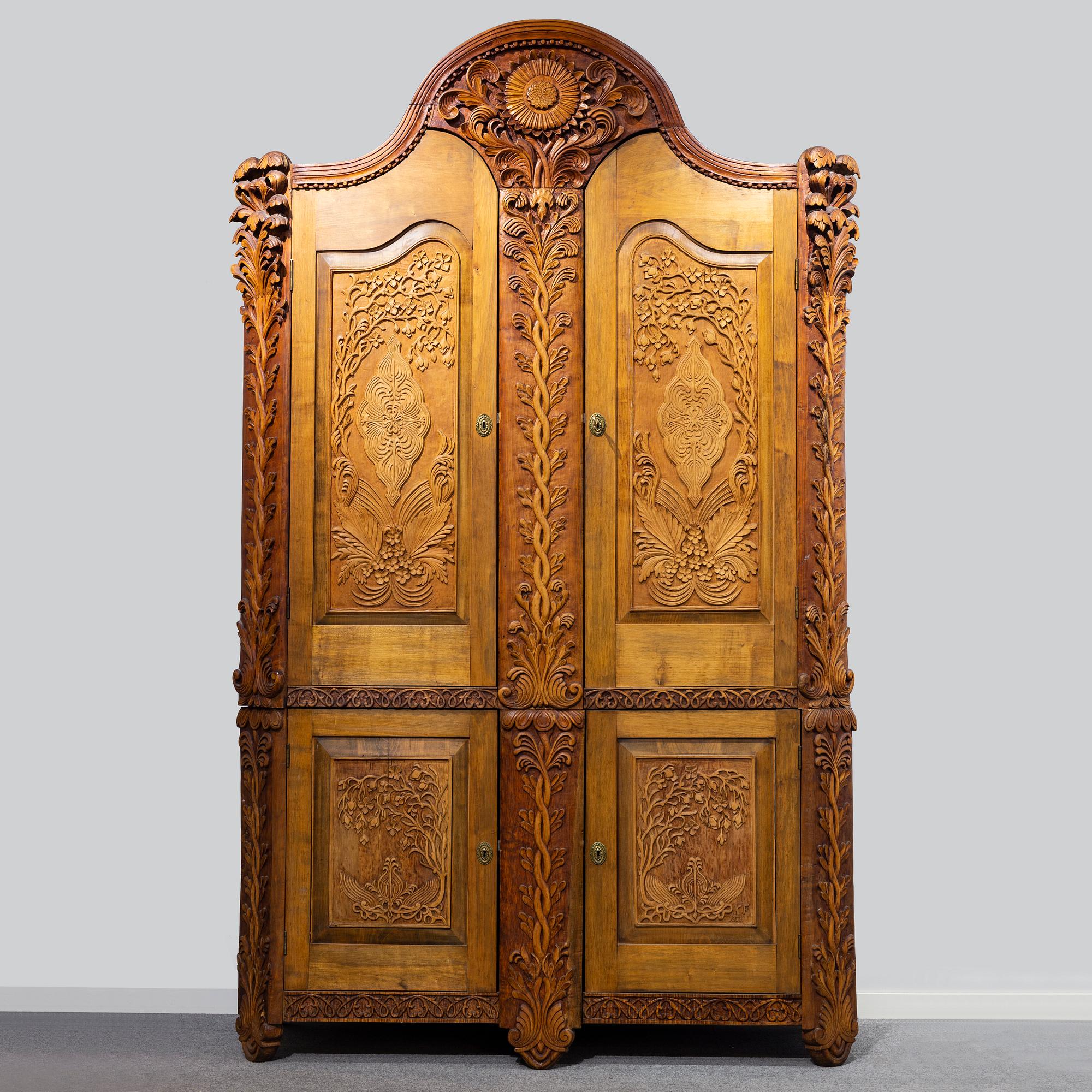 KNUT FJAESTAD, a folk art birch cabinet, early 20th century.