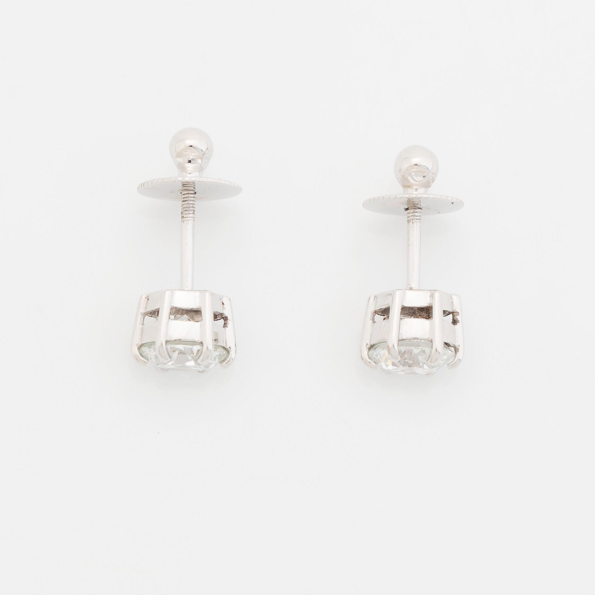 A pair of platinum earrings set with round brilliant-cut diamonds total weight 2.00 cts D if (internally flawless).