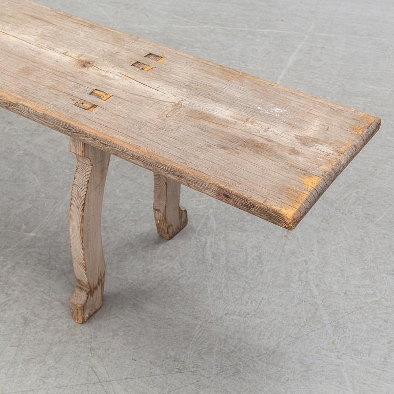 A pine bench, 19th Century.