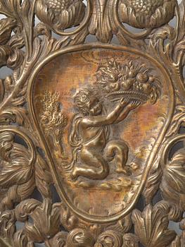 A set of four Swedish Baroque repoussé silvered brass reflector one-branch reflector plates, ca 1690-1700.