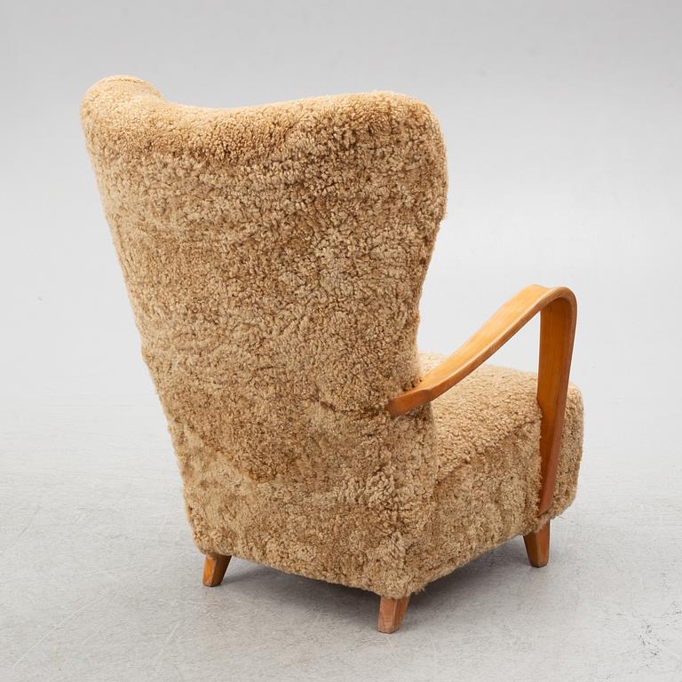 Fåtölj med fotpall, 1900-talets första hälft.