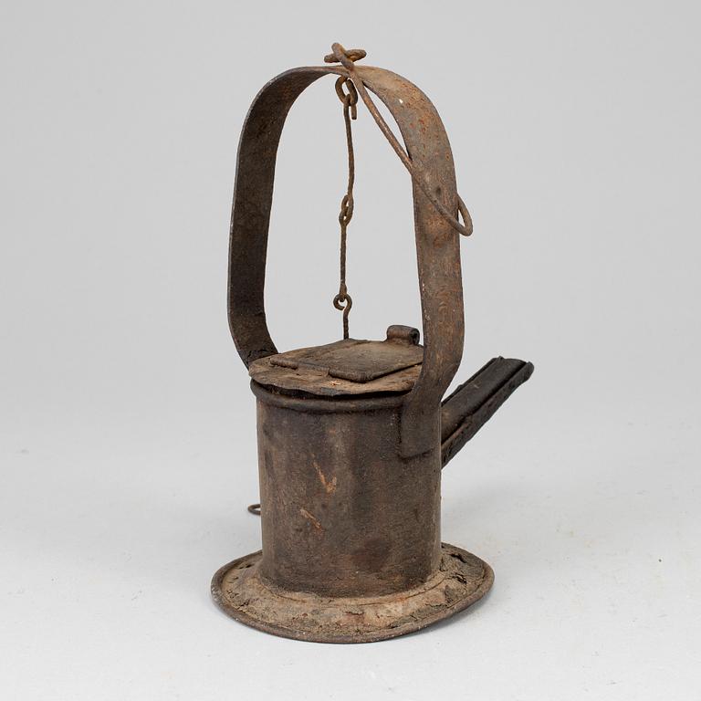 A 19th century tinplate oil lamp.