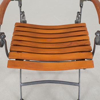 A garden table and four garden chairs from Covent Garden, 21th century.