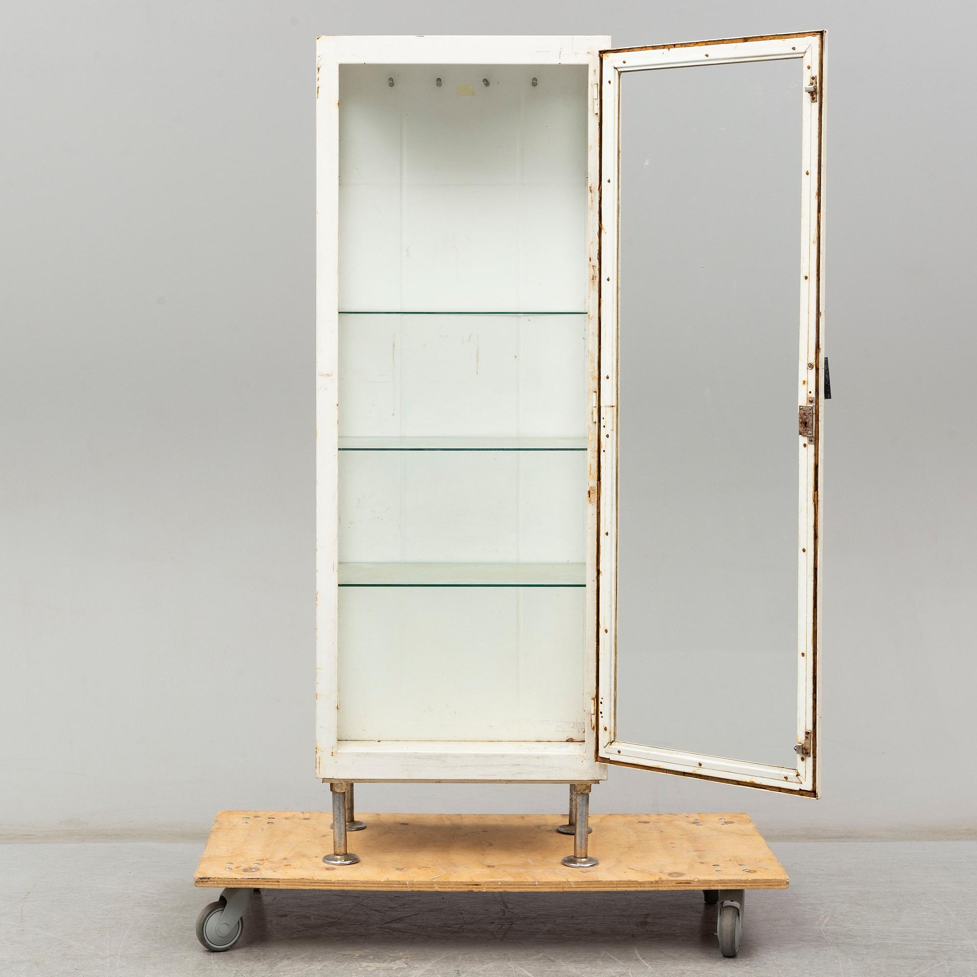 A metal doctor's cabinet, mid 20th century.