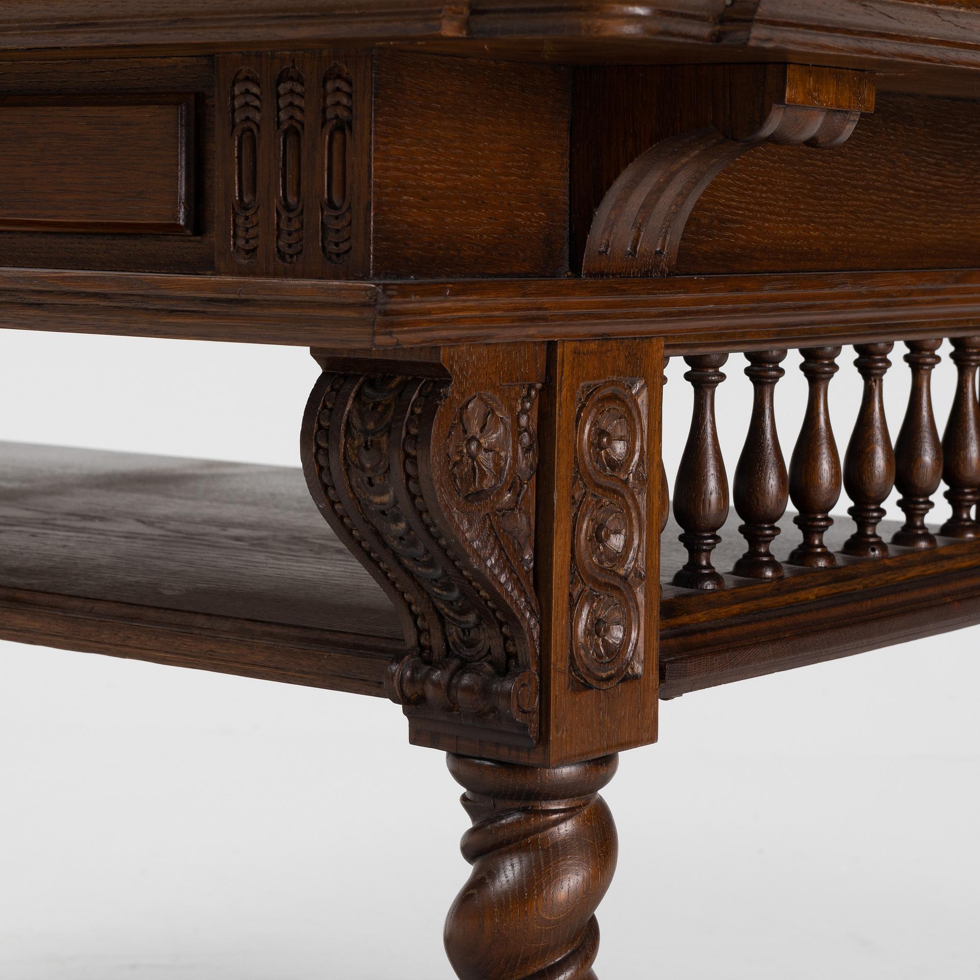 A writing desk / library table, circa 1900.