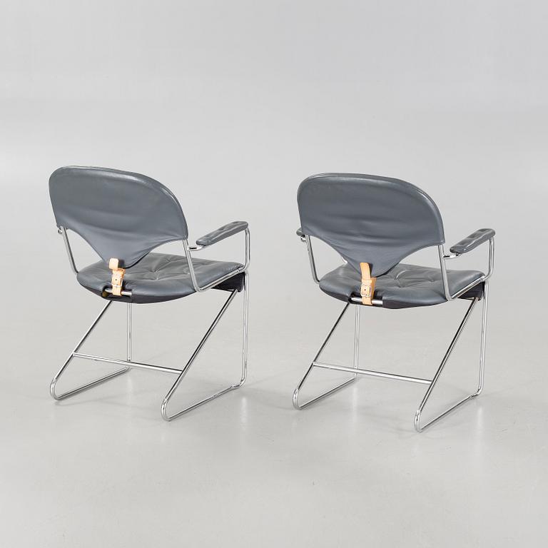 A pair of chairs by Sam Larsson for Dux, designed in 1974.