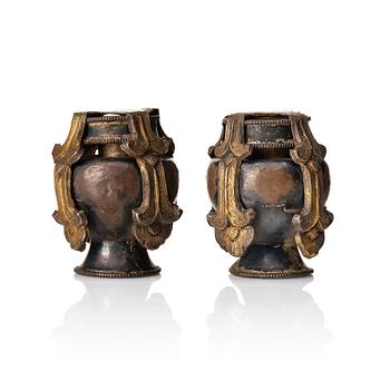 873. A pair of miniature bumbas, partly gilt, Tibeto-Chinese, 19th Century.