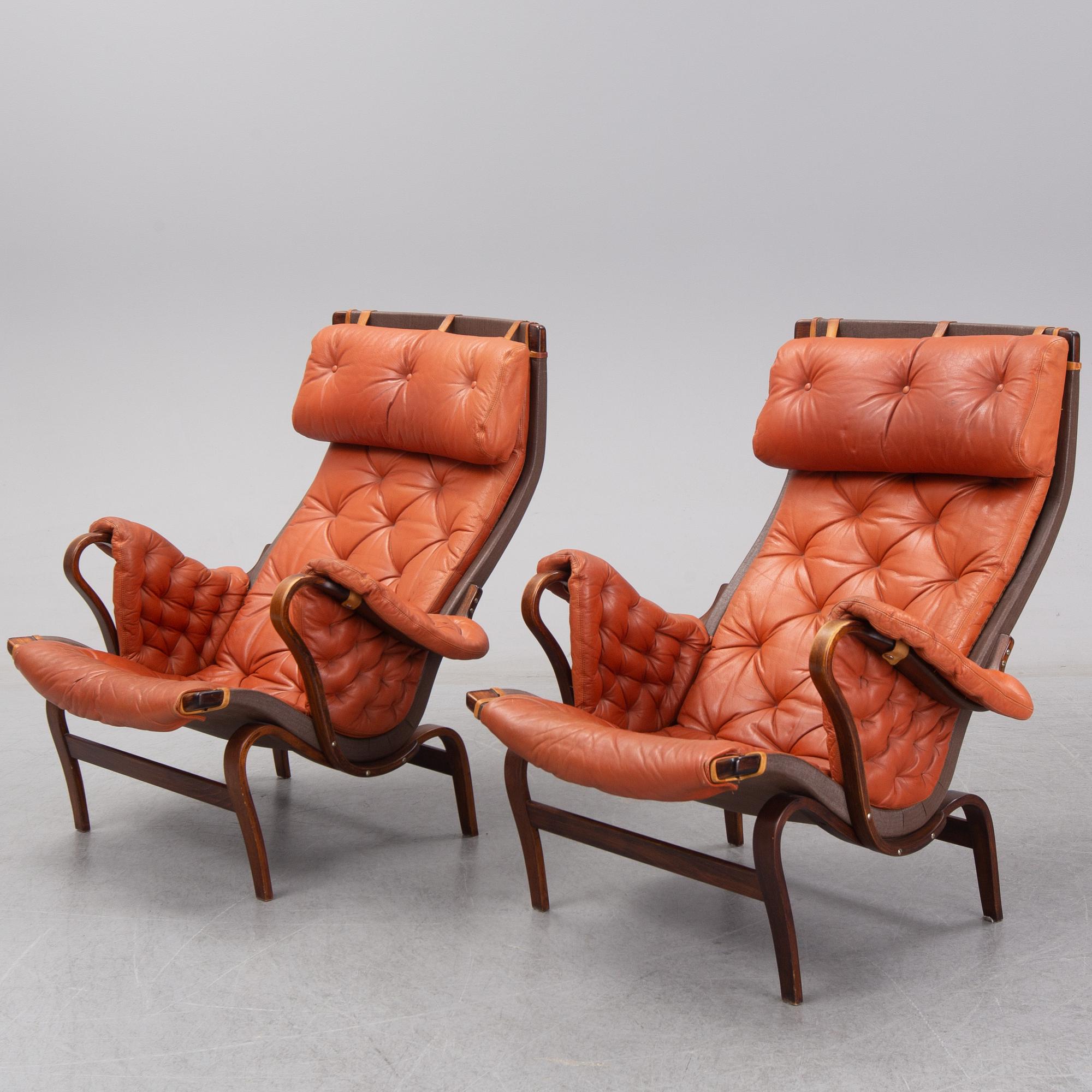 An end of the 20th Century pair of 'Pernilla' easy chairs with leather upholstery by Bruno Mathsson for DUX.