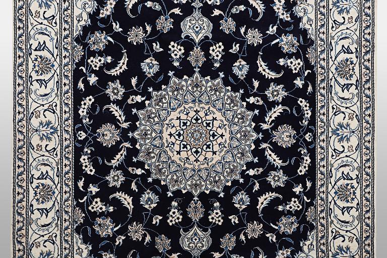 A carpet, Nain, part silk, ca 310 x 205 cm.