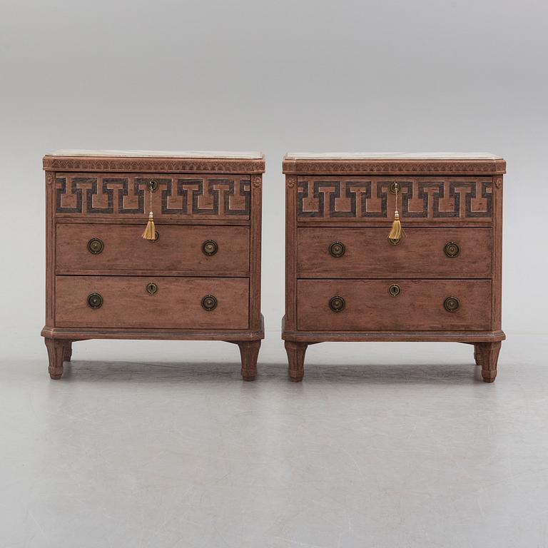 A pair of Gustavian style painted chest of drawers.