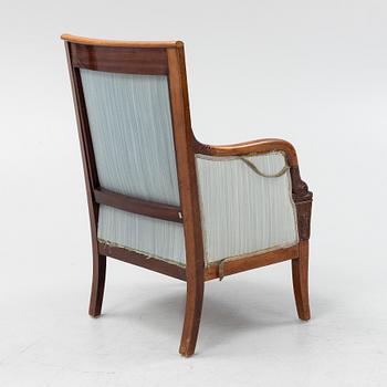 An Empire style mahogany easy chair, early 19th Century.