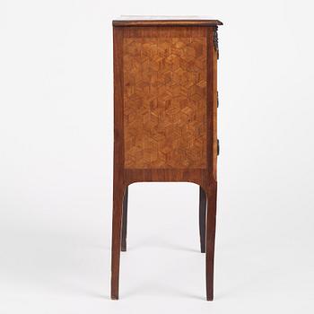 A Louis XVI-style parquetry commode, circa 1900.