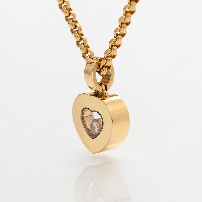 Chopard, an 18K gold 'Happy Diamonds' necklace with a heart pendant, and brilliant-cut diamond approximately 0.05 ct.