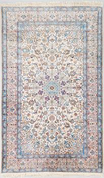 A oriental signed Nain silk carpet. Circa 267x163 cm.