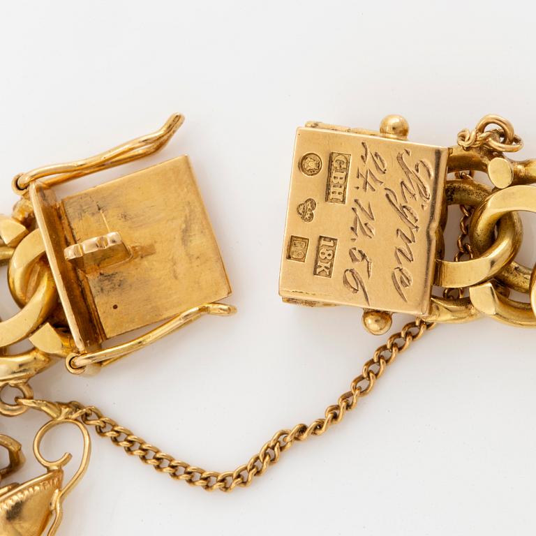 ARMBAND, 18K guld Bismarcklänk med berlocker och guldmynt.